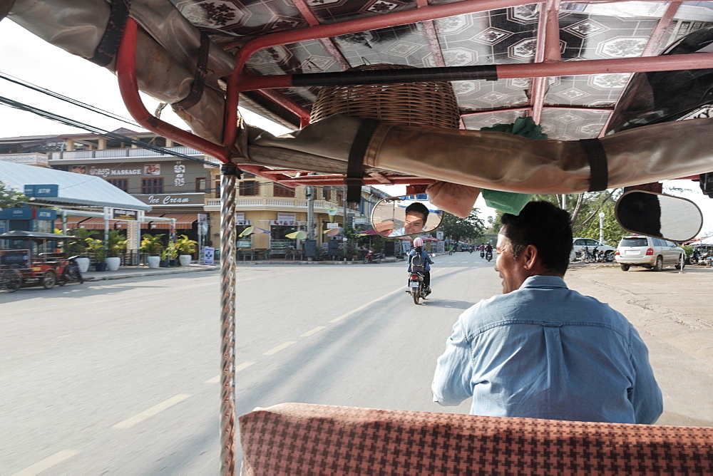 Tuk tuk driver in the streets of Kampt Town, Cambodia, Indochina, Southeast Asia, Asia