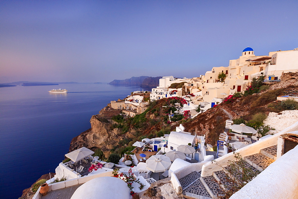 View of the Aegean Sea from the typical Greek village of Oia at dusk, Santorini, Cyclades, Greek Islands, Greece, Europe