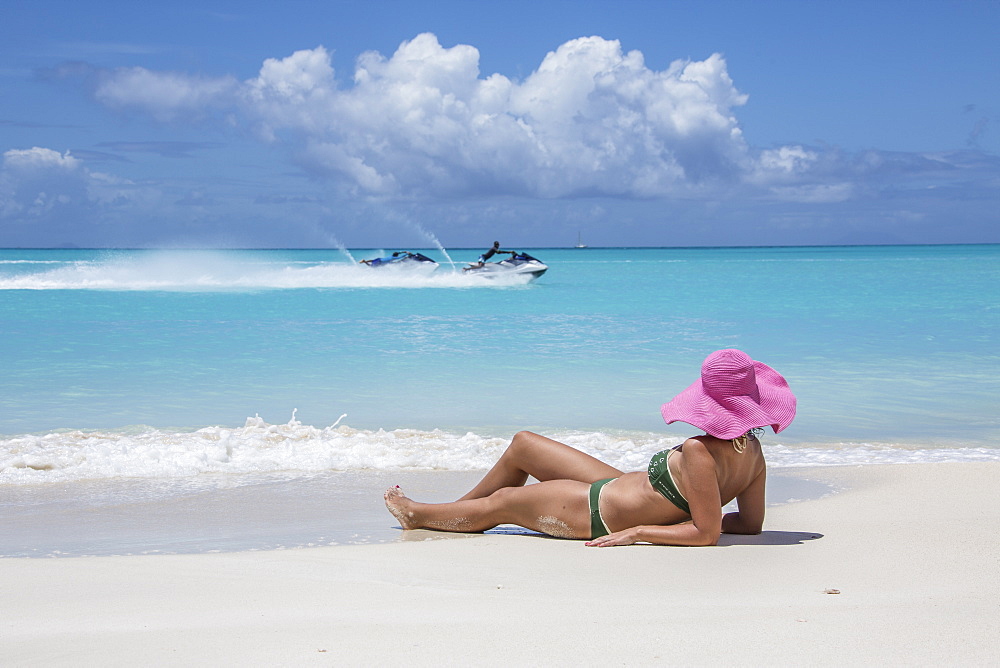 Tourist admires the turquoise Caribbean Sea, Jolly Beach, Antigua, Antigua and Barbuda, Leeward Islands, West Indies, Caribbean, Central America