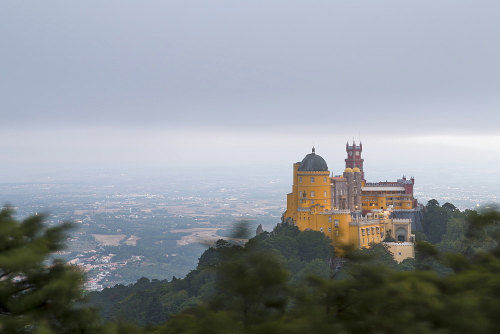 The colorful castle of Palacio da Pena, UNESCO World Heritage Site, on top of hill Sao Pedro de Penaferrim, Sintra, Lisbon district, Portugal, Europe