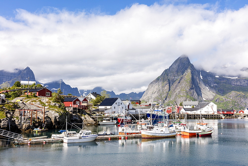 Fishing village and harbour framed by peaks and sea, Hamnoy, Moskenes, Nordland county, Lofoten Islands, Arctic, Northern Norway, Scandinavia, Europe