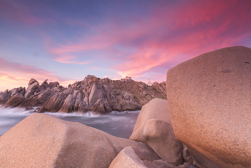 Pink sky at sunset frames the lighthouse on cliffs, Capo Testa, Santa Teresa di Gallura, Province of Sassari, Sardinia, Italy, Mediterranean, Europe