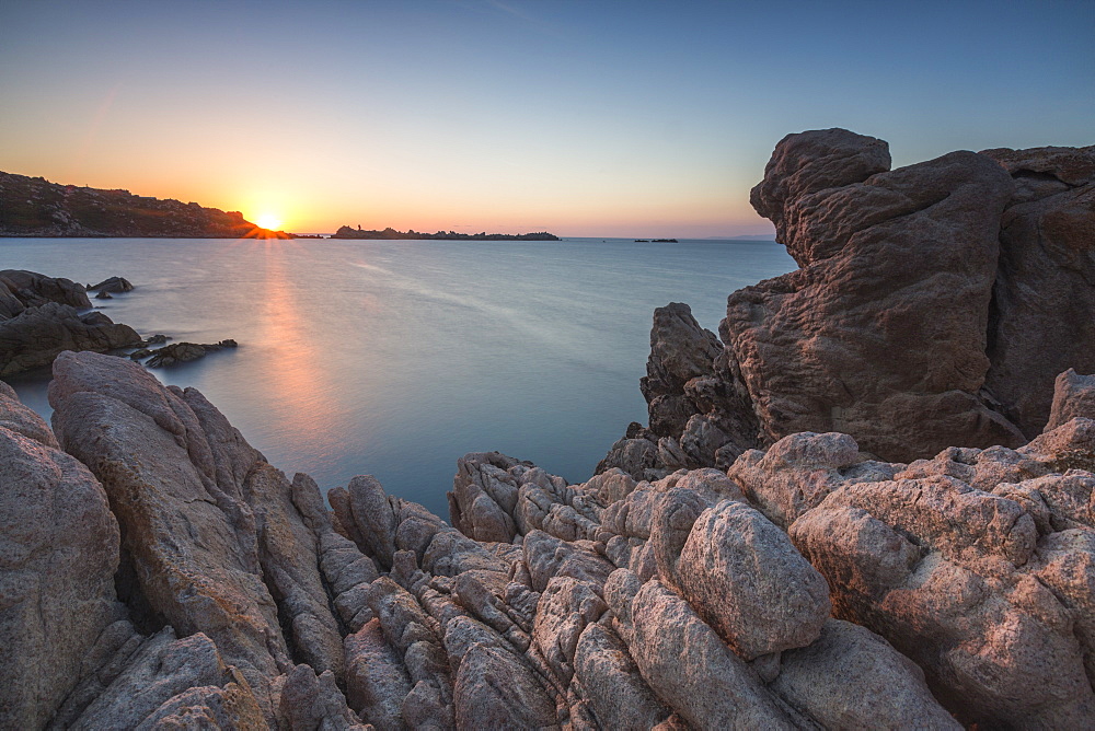 White cliffs and blue sea framed by the lights of sunset Santa Teresa di Gallura, Province of Sassari, Sardinia, Italy, Mediterranean, Europe