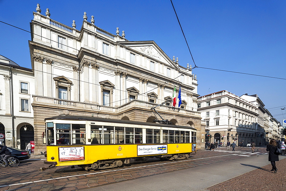 The old tram frames the Teatro Alla Scala (La Scala), icon of Milan, Lombardy, Italy, Europe