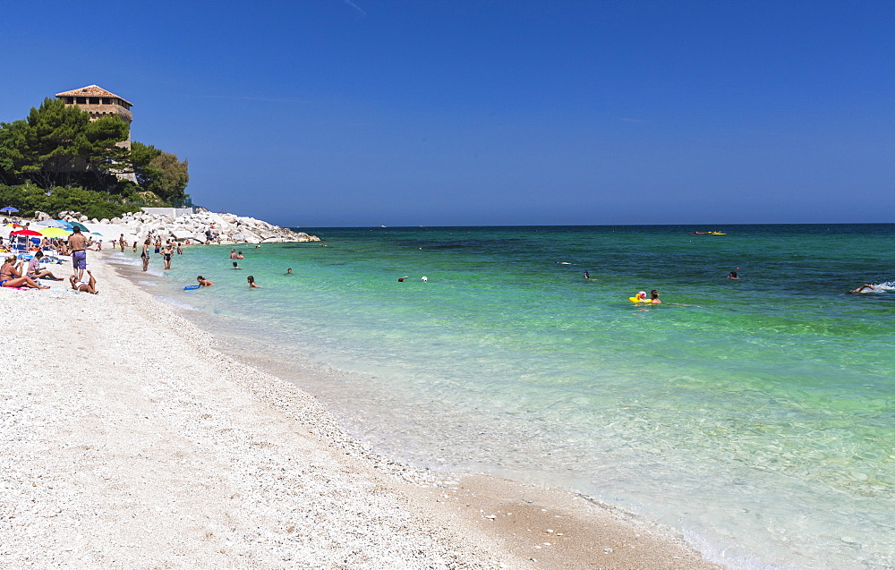 Tourists on the beach framed by the turquoise sea, Province of Ancona, Conero Riviera, Marche, Italy, Europe