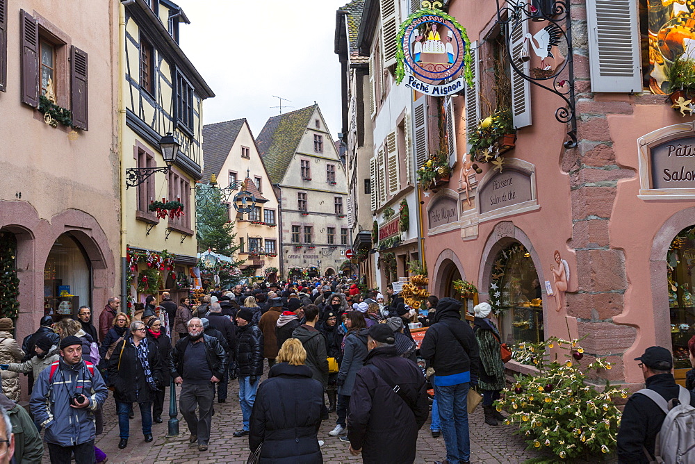 Tourists in the pedestrian road of the old town at Christmas time, Kaysersberg, Haut-Rhin department, Alsace, France, Europe