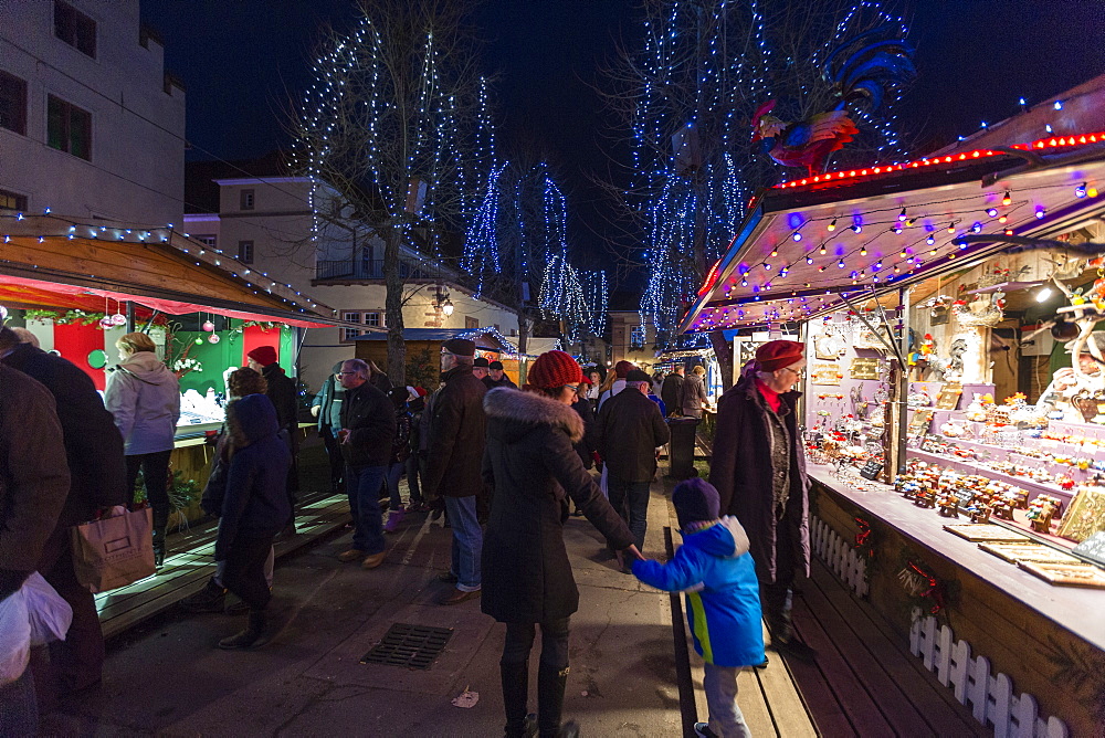 Tourists and Christmas Markets in the old medieval town of Riquewihr, Haut-Rhin department, Alsace, France, Europe