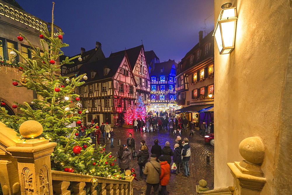 Christmas Markets in the old medieval town enriched by colourful lights, Colmar, Haut-Rhin department, Alsace, France, Europe