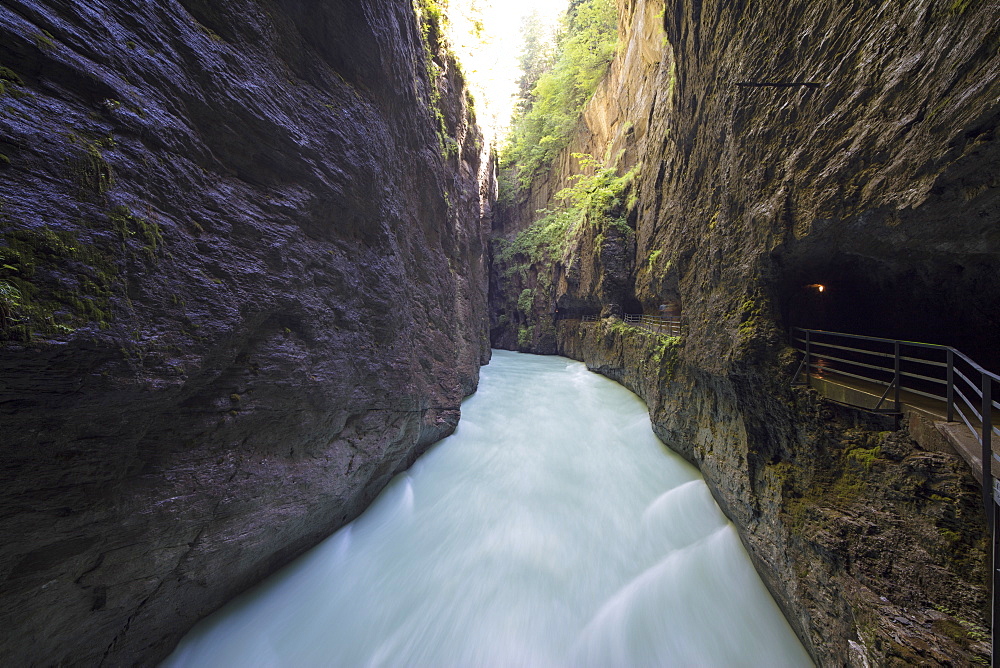 Water of creek flows in the narrow limestone gorge carved by river, Aare Gorge, Bernese Oberland, Canton of Berne, Switzerland, Europe