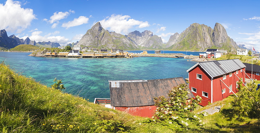 Panorama of turquoise sea and typical fishing village surrounded by rocky peaks, Sakrisoy, Reine, Moskenesoya, Lofoten Islands, Norway, Scandinavia, Europe