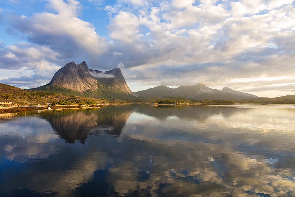 Pink clouds of midnight sun reflected in the clear water of blue sea, Anepollen Fjord, Nordland, Norway, Scandinavia, Europe