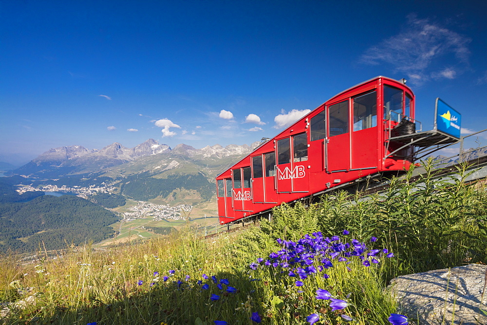 The funicular railway runs across the alpine meadows, Muottas Muragl, Samedan, Canton of Graubunden, Engadine, Switzerland, Europe