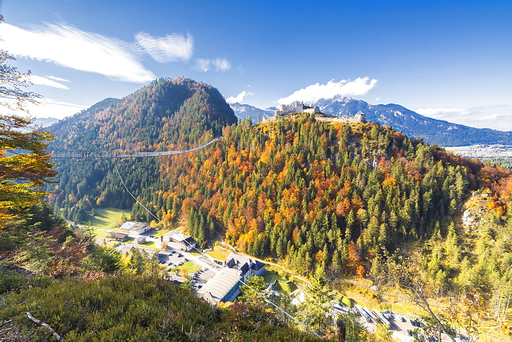 View of the old Ehrenberg Castle surrounded by colorful woods and suspension bridge, Highline 179, Reutte, Austria, Europe