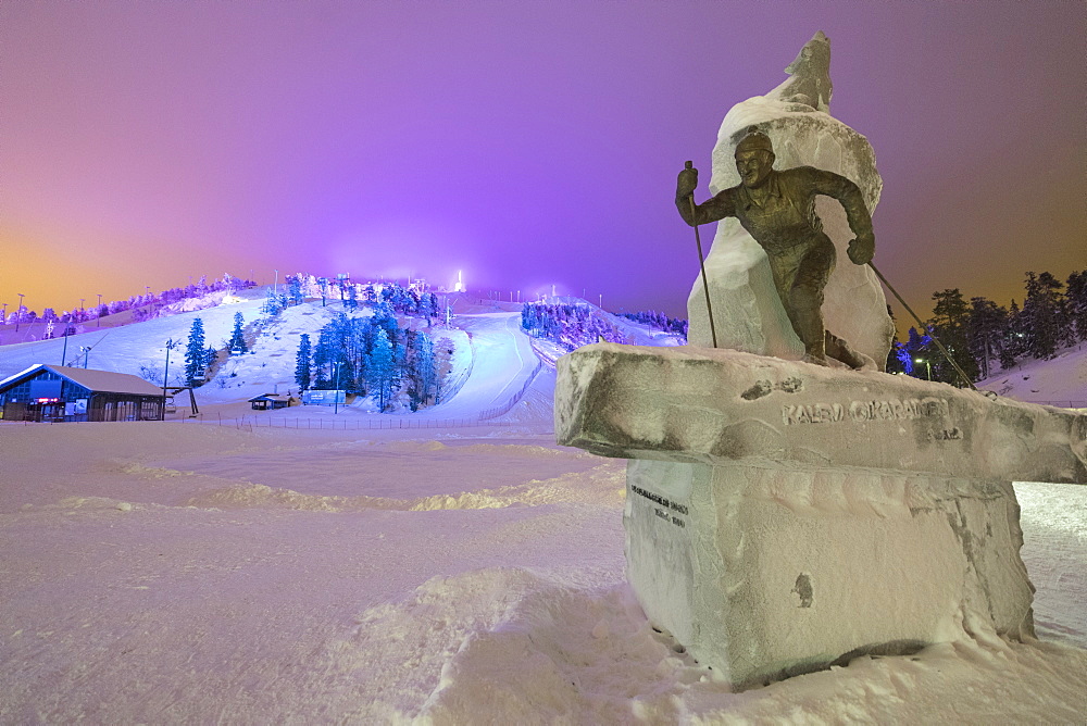 Lights on the ski slopes surrounded by snowy woods, Ruka, Kuusamo, Ostrobothnia region, Lapland, Finland, Europe