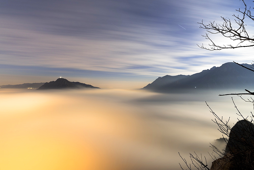 Fog and clouds at dawn seen from Monte San Martino, Province of Lecco, Lombardy, Italy, Europe