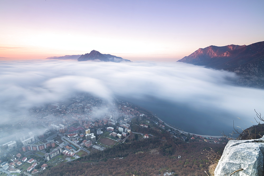 Fog at sunrise above the city of Lecco seen from Monte San Martino, Province of Lecco, Lombardy, Italy, Europe