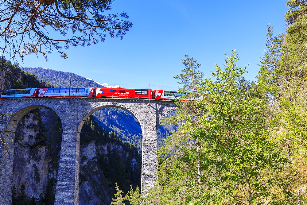 Bernina Express train on Landwasser Viadukt, UNESCO World Heritage Site, Filisur, Albula Region, Canton of Graubunden, Switzerland, Europe