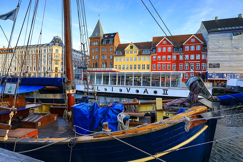 Boats in Christianshavn Canal with typical colorful houses in the background, Copenhagen, Denmark, Europe