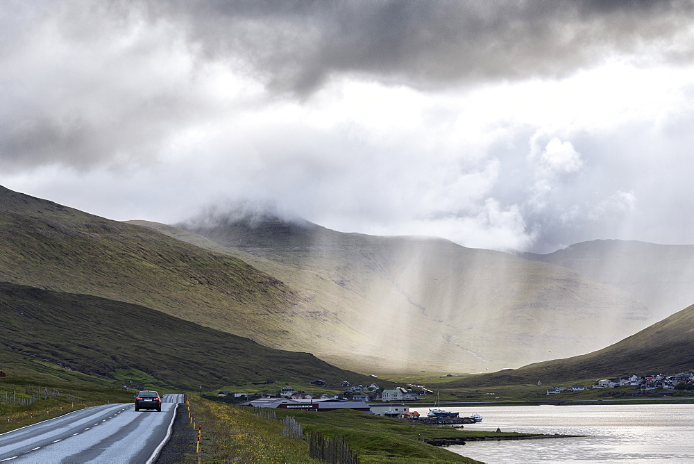 Car on road to Hvalvik, Streymoy Island, Faroe Islands, Denmark, Europe