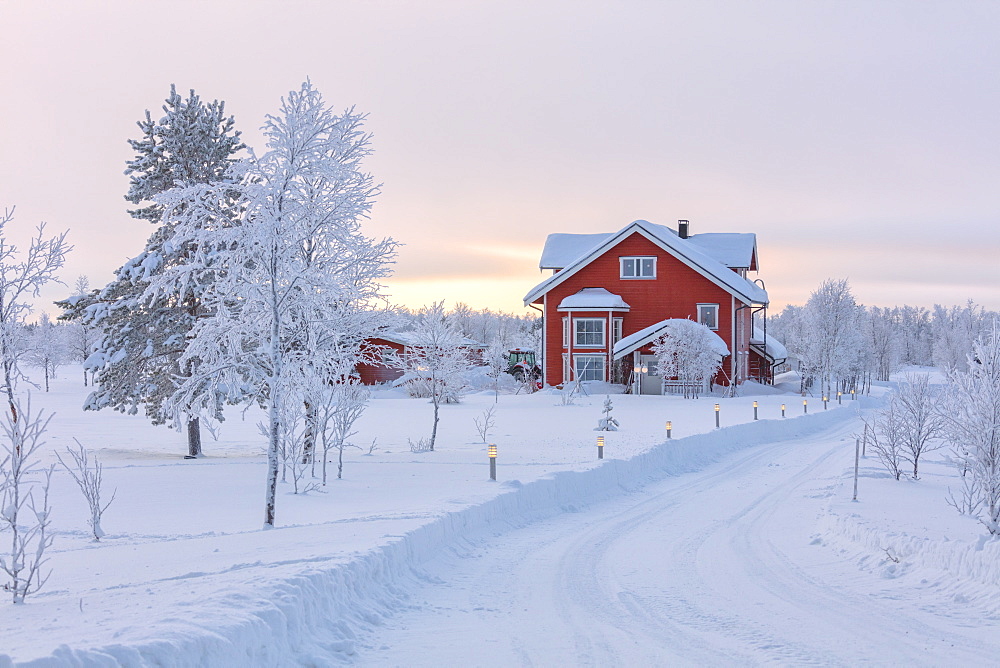 Typical house in the snowy forest, Muonio, Lapland, Finland, Europe