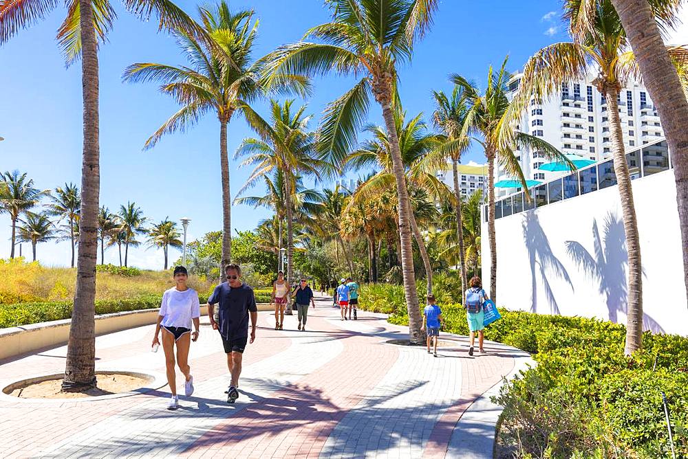 People walk on promenade, Miami Beach, Florida, United States of America, North America