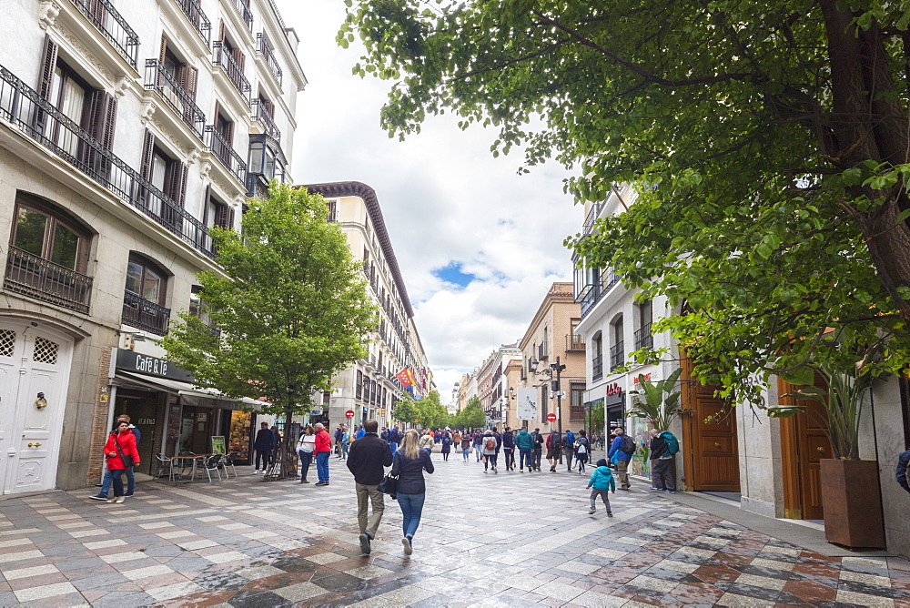 People on pedestrian street walking towards Plaza de la Puerta del Sol, Madrid, Spain, Europe