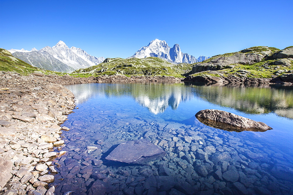 The Mont Blanc mountain range reflected in the waters of Lac des Cheserys, Haute Savoie, French Alps, France, Europe