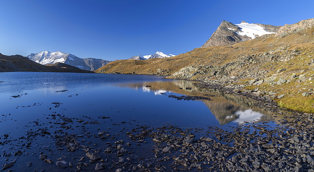 Panorama of Levanne mountains and Aiguille Rousse at sunrise, Gran Paradiso National Park, Alpi Graie (Graian Alps), Italy, Europe