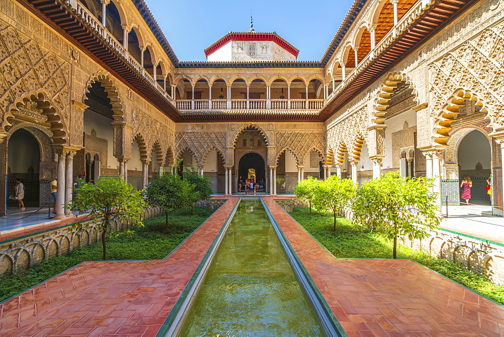 Patio de las Doncellas, a decorated courtyard and pool in typical Mudejar architecture, Real Alcazar, UNESCO World Heritage Site, Seville, Andalusia, Spain, Europe