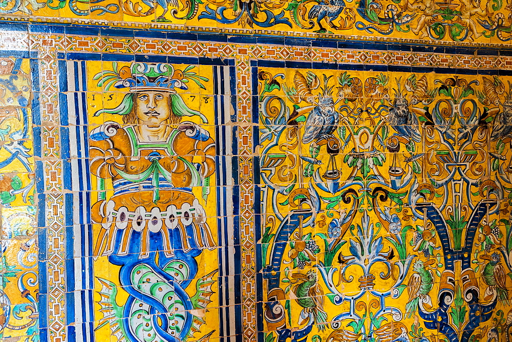 Close-up of ceramic wall of colorful tiles with human figure and allegorical scenes, Real Alcazar, UNESCO World Heritage Site, Seville, Andalusia, Spain, Europe