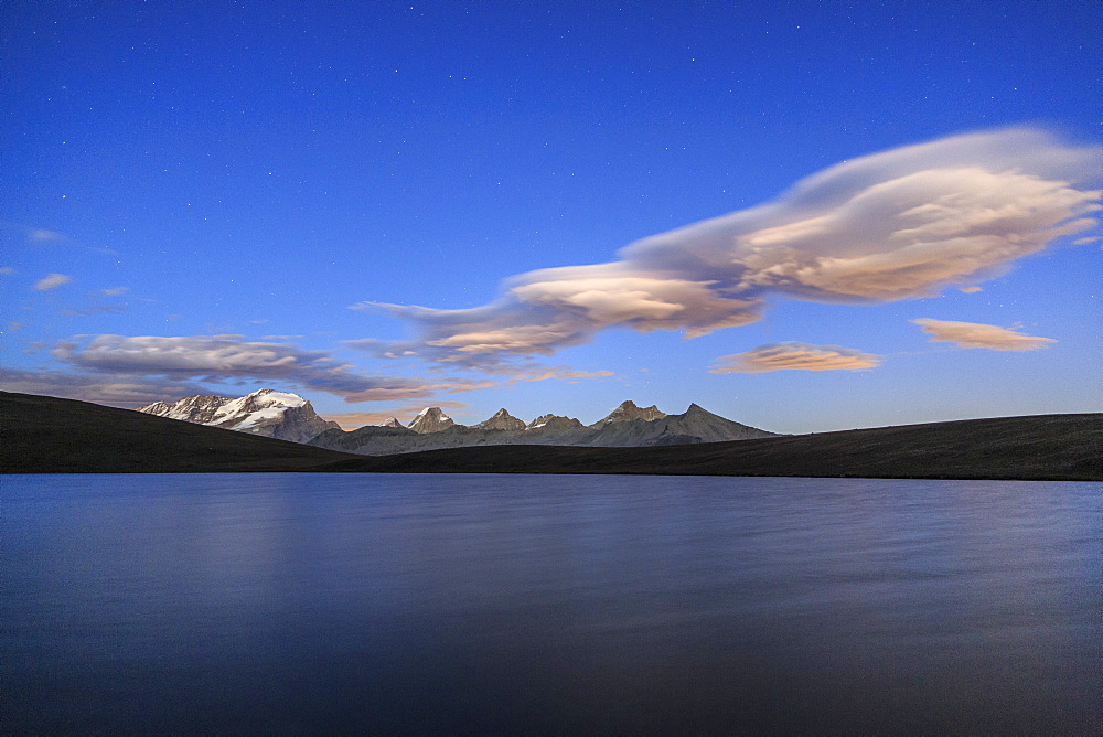 Pink clouds after sunset on Rosset Lake at an altitude of 2709 meters, Gran Paradiso National Park, Alpi Graie (Graian Alps), Italy, Europe