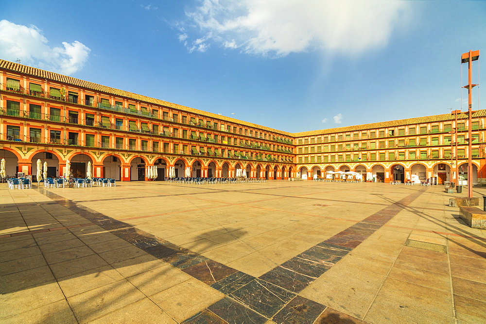 Orange colored buildings and arcades of Plaza de la Corredera (Corredera Square), the main square of Cordoba, Andalusia, Spain, Europe