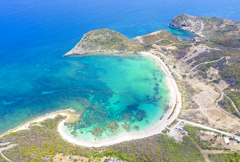 Aerial view by drone of the fine white sand of Half Moon Bay washed by Caribbean Sea, Antigua, Leeward Islands, West Indies, Caribbean, Central America