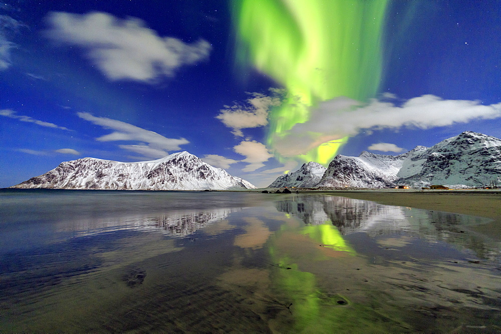 Northern Lights (aurora borealis) and mountains reflected in the cold waters, Skagsanden, Lofoten Islands, Arctic, Norway, Scandinavia, Europe