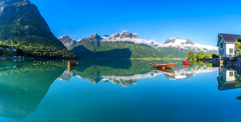 Panoramic of mountains reflected in the clear water of Oppstrynsvatn lake, Hjelle, Oppstryn, Sogn og Fjordane county, Norway, Scandinavia, Europe