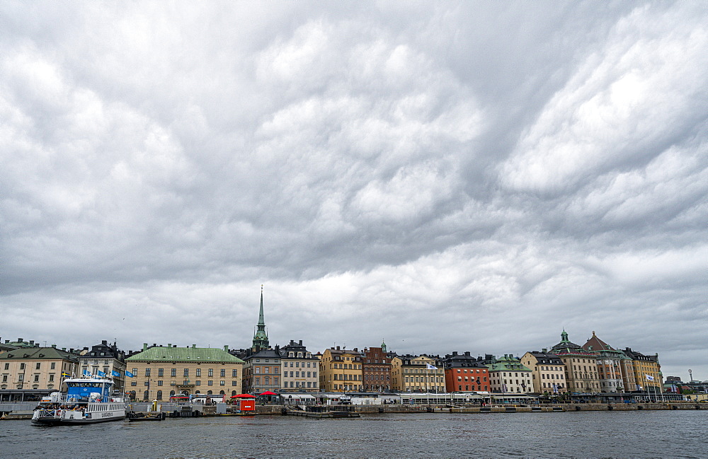 Storm clouds over the historic buildings of Gamla Stan by the sea, Stockholm, Sweden, Scandinavia, Europe