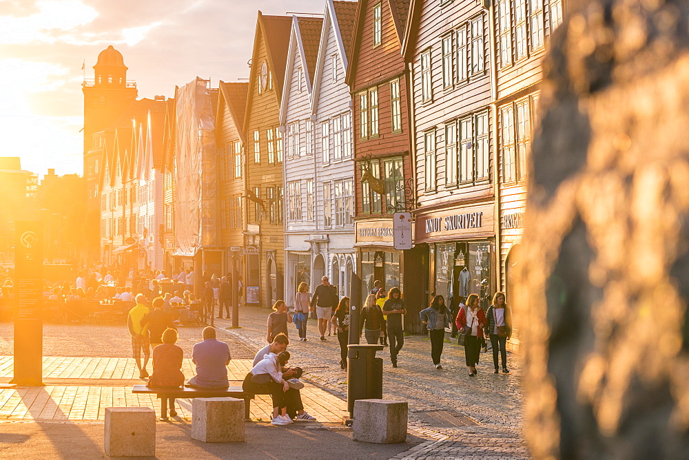 Tourists in Bryggen Old Town at sunset, UNESCO World Heritage Site, Bergen, Hordaland County, Norway, Scandinavia, Europe