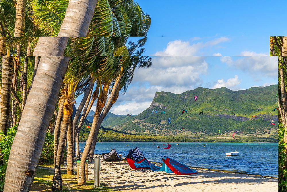 Kitesurf in the ocean seen from tropical palm-fringed beach, Le Morne Brabant, Black River district, Mauritius, Indian Ocean, Africa