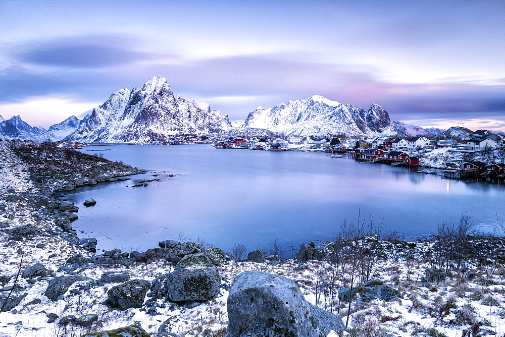 Pinksky dominates the scenery in Reine at dusk, Lofoten Islands, Arctic, Norway, Scandinavia, Europe