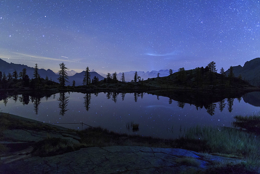 Starry night on Mount Rosa seen from Lake Vallette, Natural Park of Mont Avic, Aosta Valley, Graian Alps, Italy, Europe