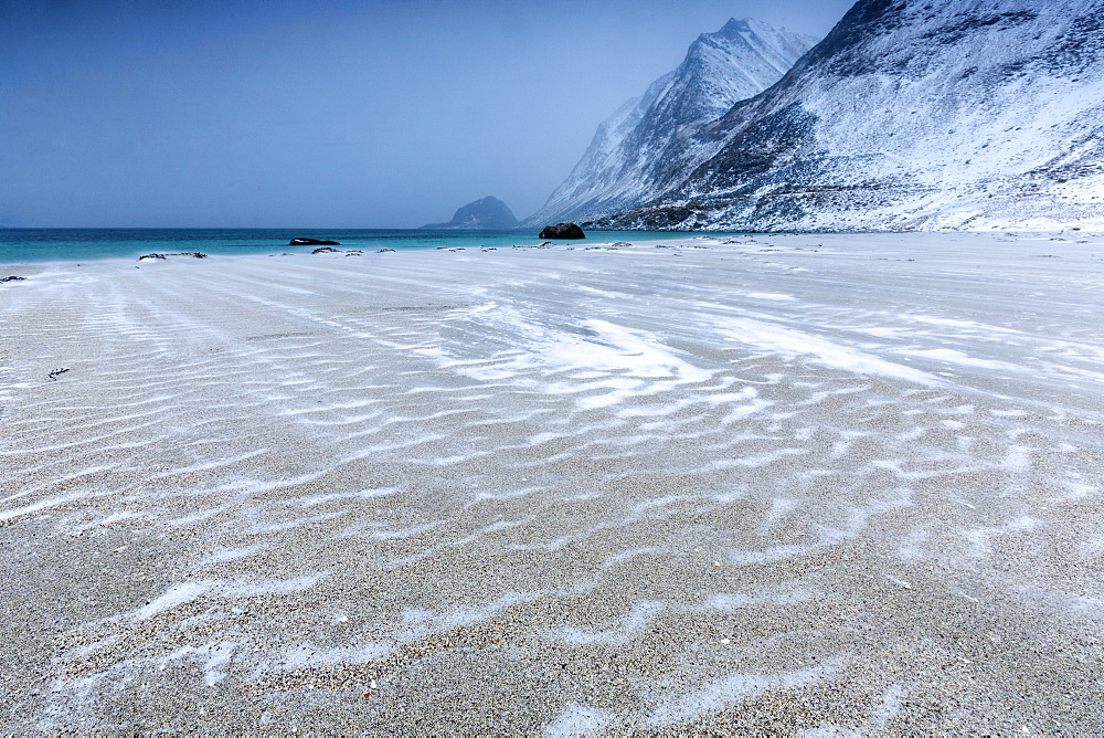 Beach partially snowy surrounded by mountains, Haukland, Lofoten Islands, Northern Norway, Scandinavia, Arctic, Europe