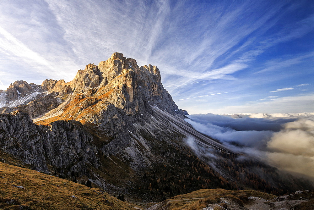 Low clouds and dawn lights on the peaks of Forcella De Furcia, Funes Valley, South Tyrol, Dolomites, Italy, Europe