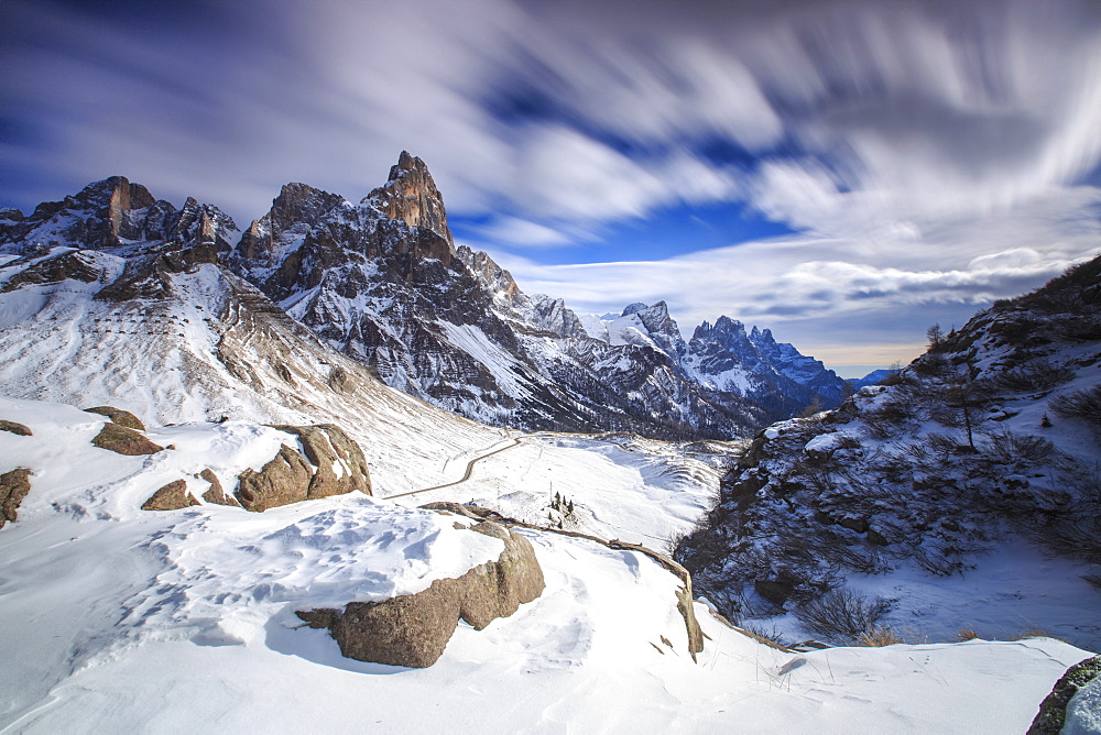 Cloudy winter sky on the snowy peaks of the Pale di San Martino, Rolle Pass, Panaveggio, Dolomites, Trentino-Alto Adige, Italy, Europe