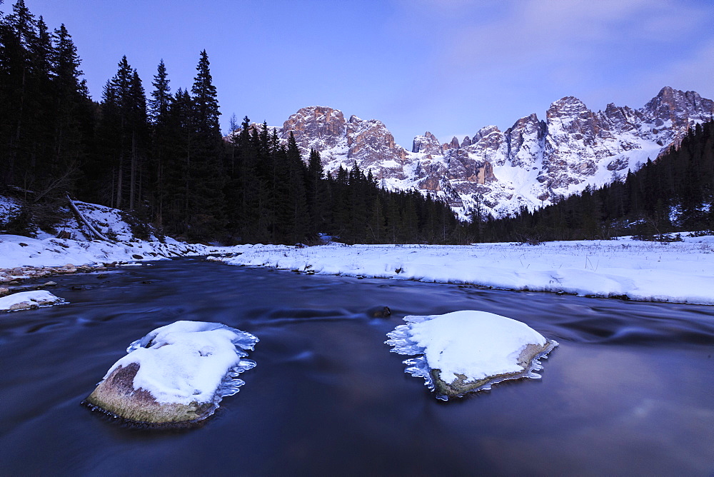 A frozen creek under a cold winter sky, Venagia Valley, Panaveggio Natural Park, Dolomites, Trentino-Alto Adige, Italy, Europe