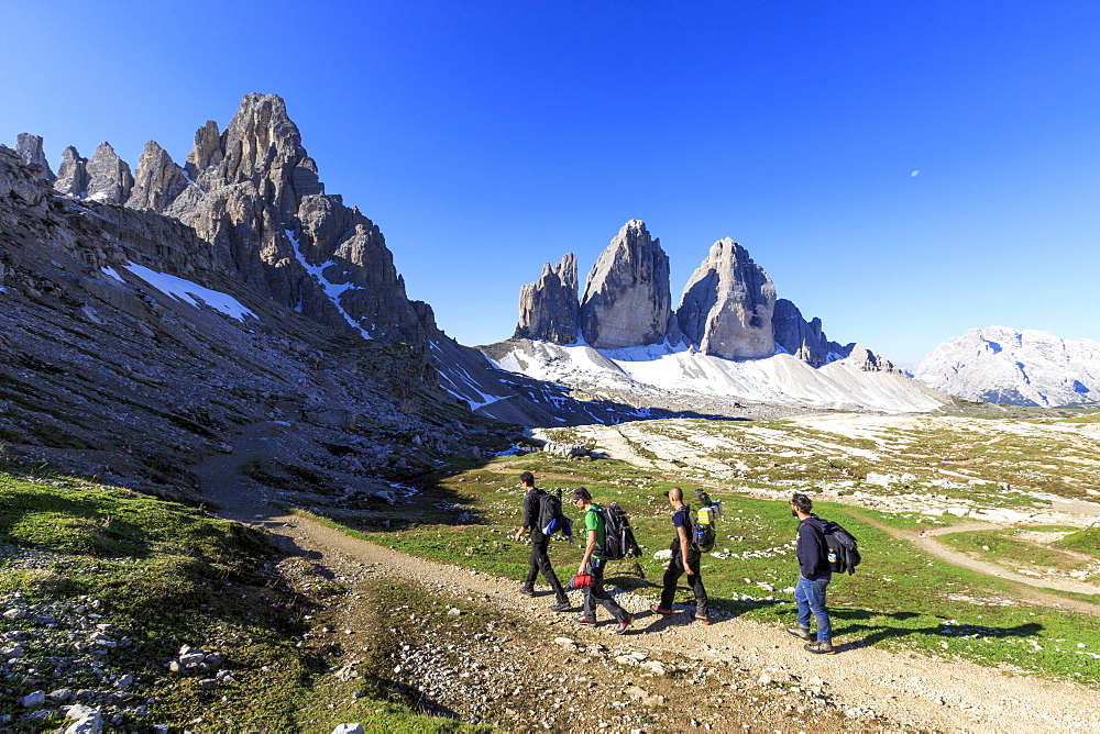 Hikers venturing to discover the Three Peaks of Lavaredo, Sesto, Dolomites, Trentino-Alto Adige, Italy, Europe