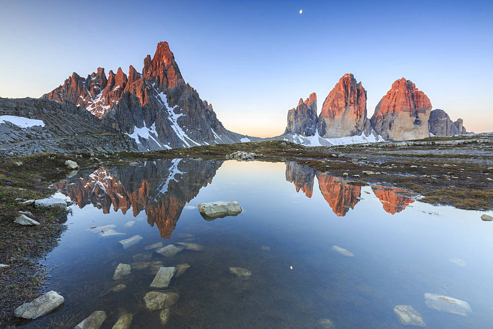 Dawn illuminates the Three Peaks and Mount Paterno  reflected in the lake, Sesto, Dolomites, Trentino-Alto Adige, Italy, Europe