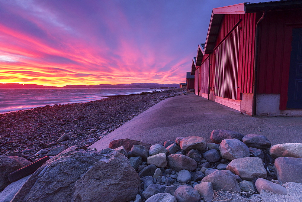 The colors of dawn light up the houses of fishermen, Arland Brekstad, Trondelag, Norway, Scandinavia, Europe