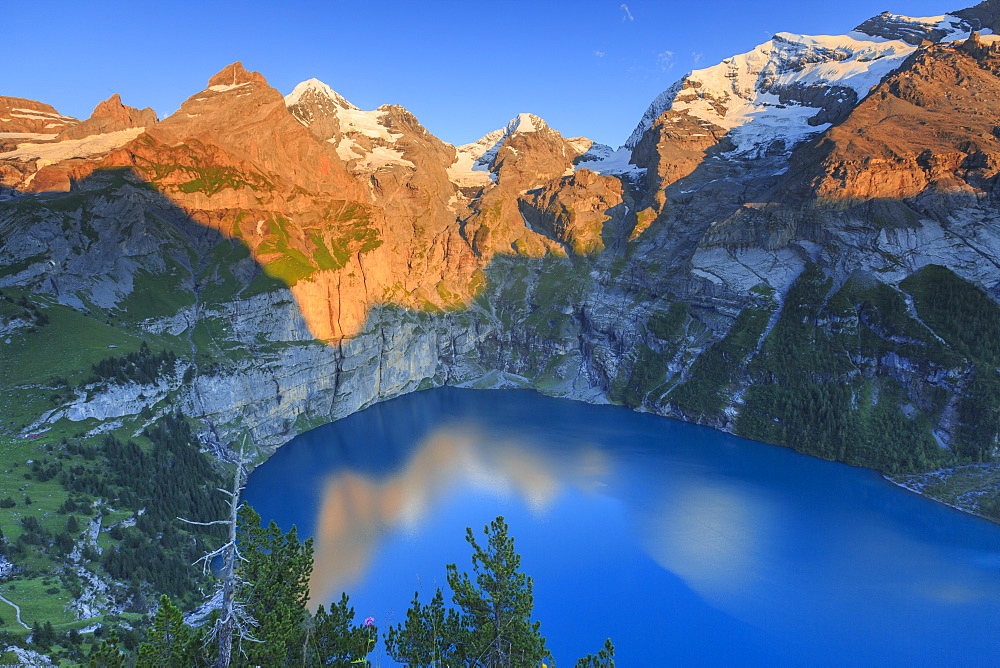 Sunset on Lake Oeschinensee, Bernese Oberland, Kandersteg, Canton of Bern, Switzerland, Europe