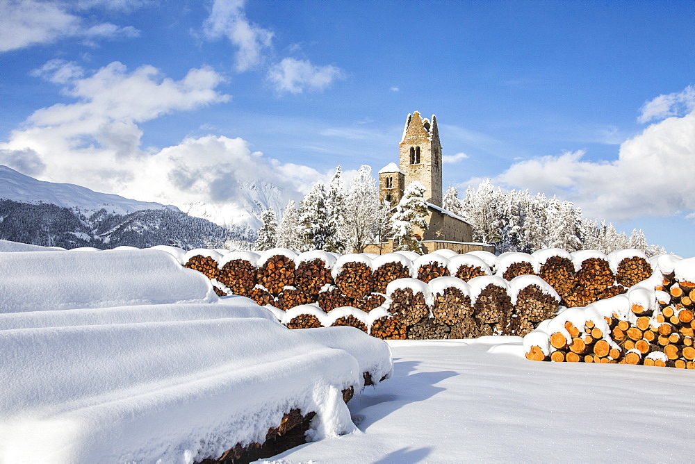 The church of San Gian surrounded by snowy woods, Celerina, Engadine, Canton of Grisons (Graubunden), Switzerland, Europe