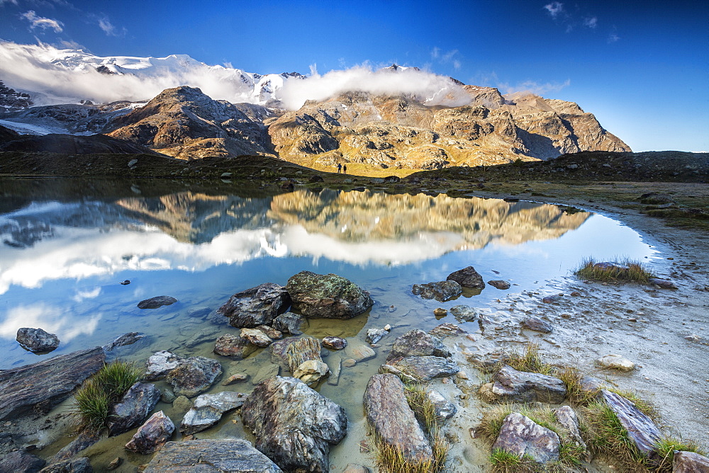 Sunrise reflections at Lake Rosole, Forni Valley, Valfurva, Valtellina, Lombardy, Italy, Europe